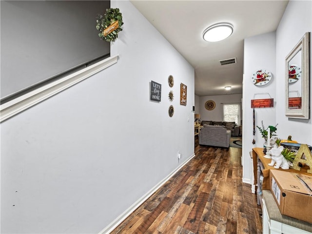 hallway featuring dark hardwood / wood-style flooring