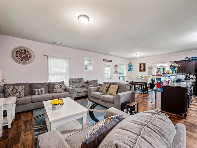 living room featuring dark hardwood / wood-style floors