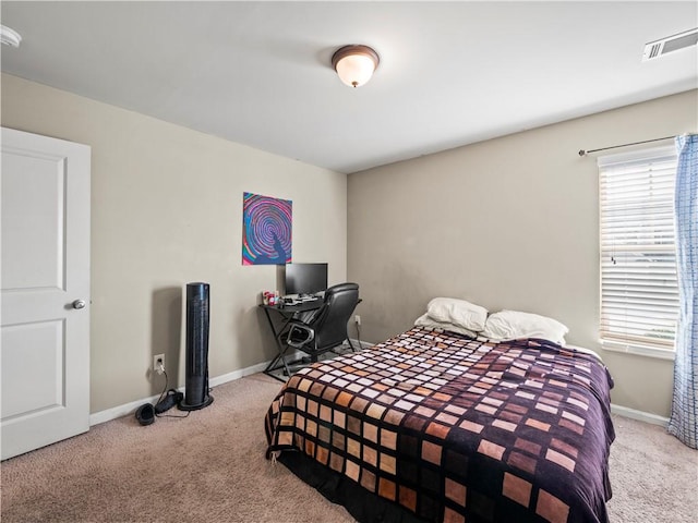 bedroom featuring light colored carpet