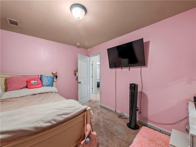 bedroom with light colored carpet