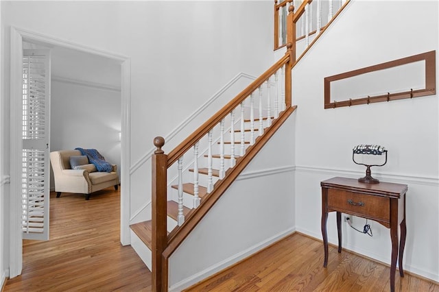 staircase with wood finished floors