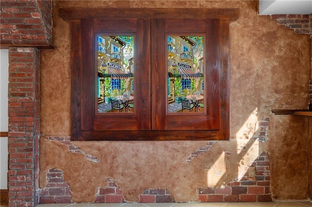 view of exterior entry featuring french doors