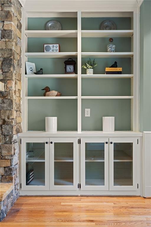 interior details with built in features and wood finished floors