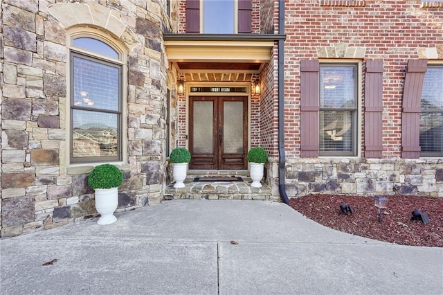 view of exterior entry featuring french doors