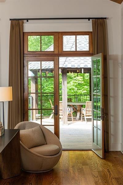 doorway with wood finished floors and french doors