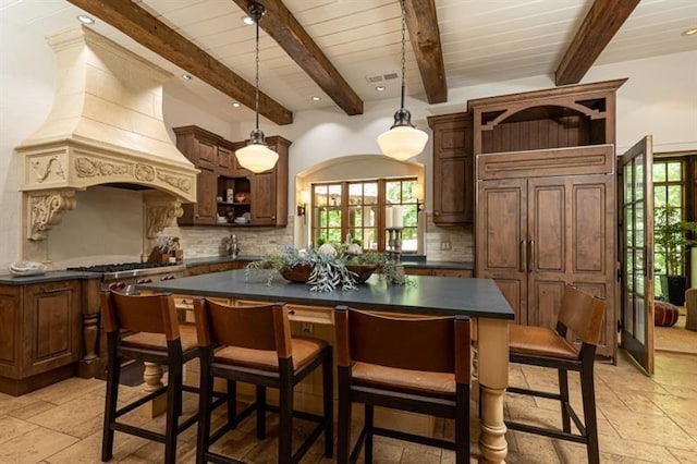 kitchen featuring open shelves, dark countertops, decorative backsplash, and custom range hood
