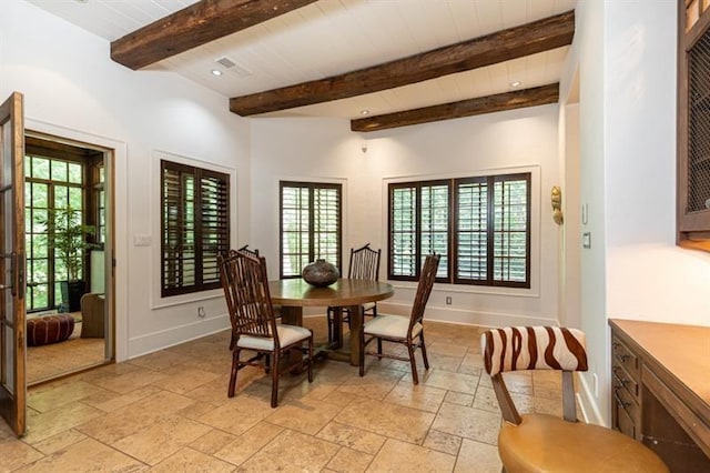 dining room featuring beam ceiling, baseboards, stone tile flooring, and recessed lighting