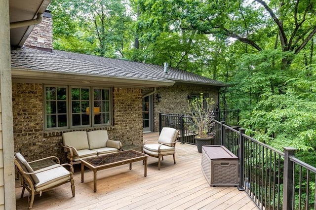 wooden deck with an outdoor living space
