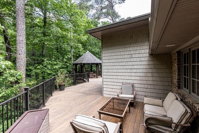 wooden deck featuring a gazebo