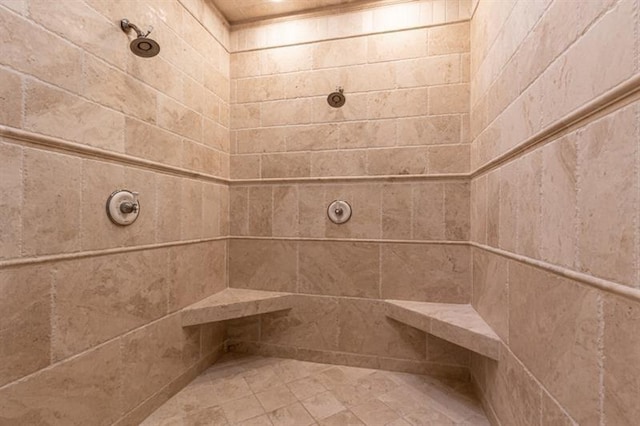 full bathroom with a tile shower