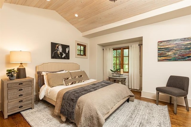 bedroom featuring lofted ceiling, wooden ceiling, and wood finished floors