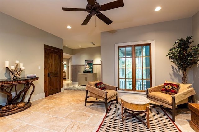 living area featuring a ceiling fan and recessed lighting