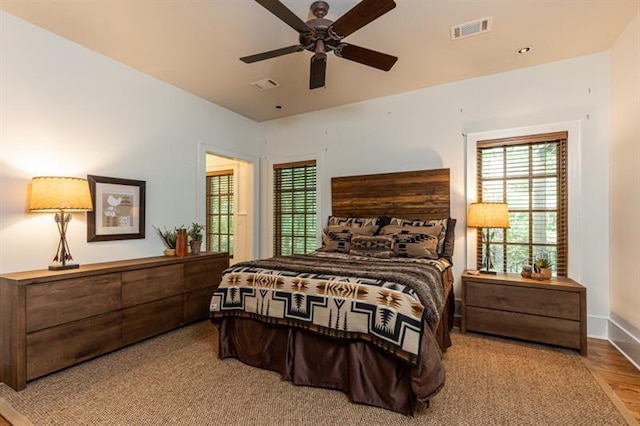 bedroom with visible vents and baseboards