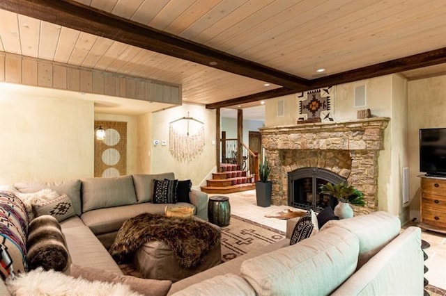 living room with visible vents, wood ceiling, beamed ceiling, stairs, and a fireplace