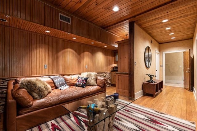 living room with light wood-style floors, recessed lighting, wood ceiling, and visible vents