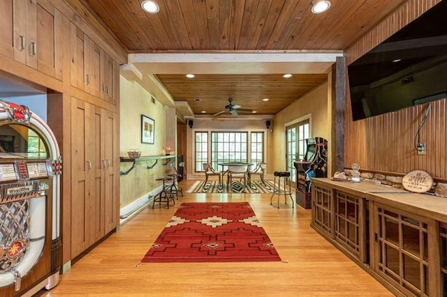 corridor featuring light wood-type flooring, recessed lighting, and wooden ceiling