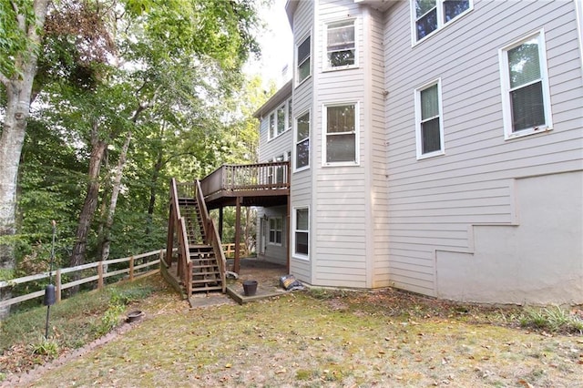 rear view of property with a wooden deck