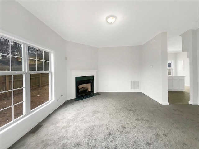 unfurnished living room with carpet flooring