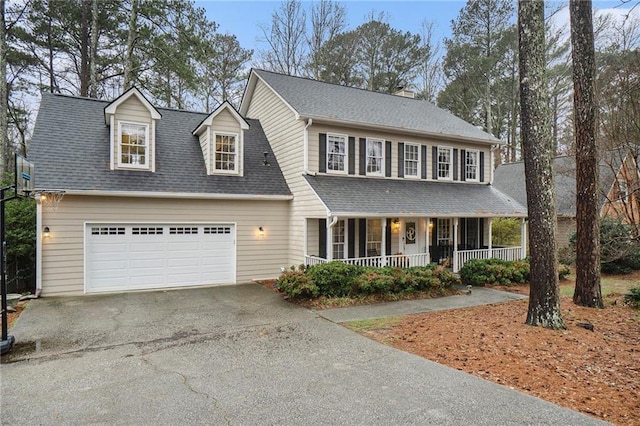 view of front facade featuring a garage and a porch