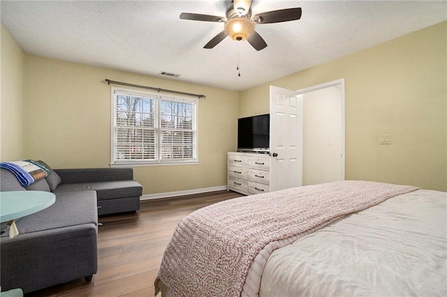 bedroom featuring hardwood / wood-style floors and ceiling fan