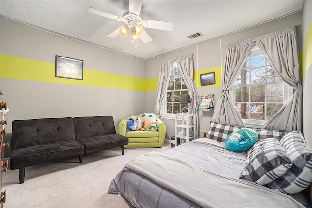 bedroom with ceiling fan and carpet