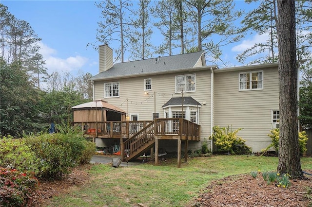 back of house with a gazebo, a yard, and a deck