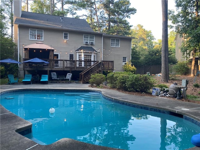 view of swimming pool with a wooden deck and a gazebo