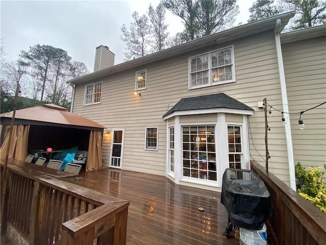 deck with a gazebo and a grill