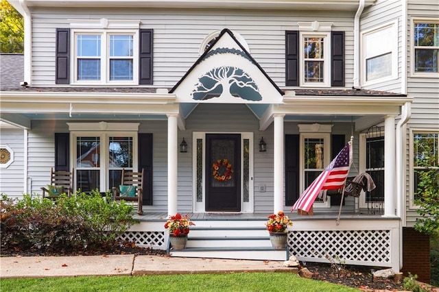 view of front of home featuring roof with shingles