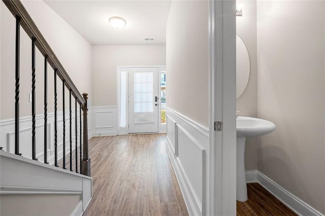 foyer entrance featuring wood-type flooring