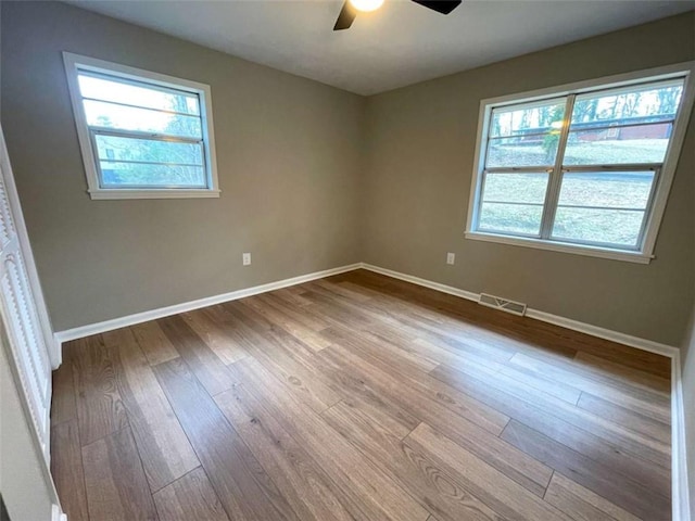 spare room with ceiling fan and light hardwood / wood-style floors