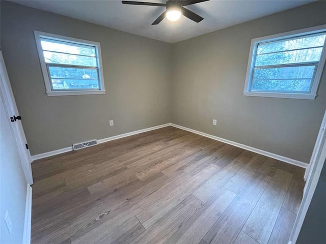 unfurnished room featuring ceiling fan and wood-type flooring