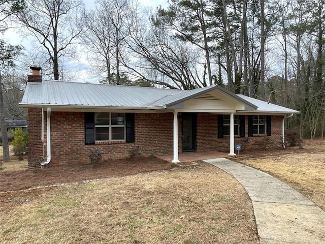 ranch-style home with a front lawn