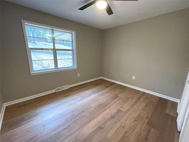 unfurnished room with ceiling fan and light hardwood / wood-style floors