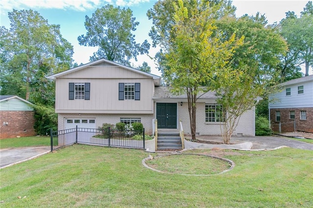 split level home with a front yard and a garage