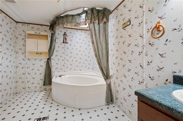 bathroom with visible vents, wallpapered walls, a garden tub, tile patterned floors, and vanity