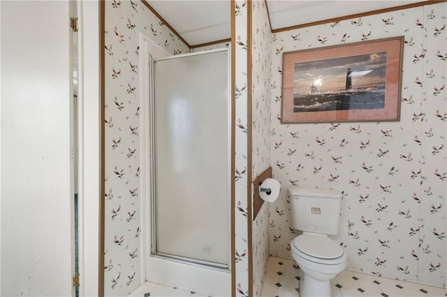 full bathroom with toilet, a stall shower, and wallpapered walls