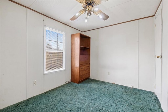 unfurnished bedroom featuring carpet flooring, ceiling fan, and ornamental molding