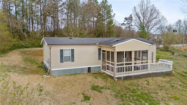 rear view of property with a yard