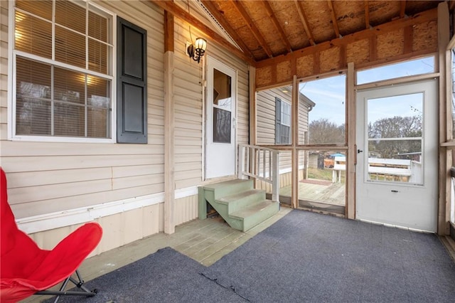 sunroom / solarium with lofted ceiling