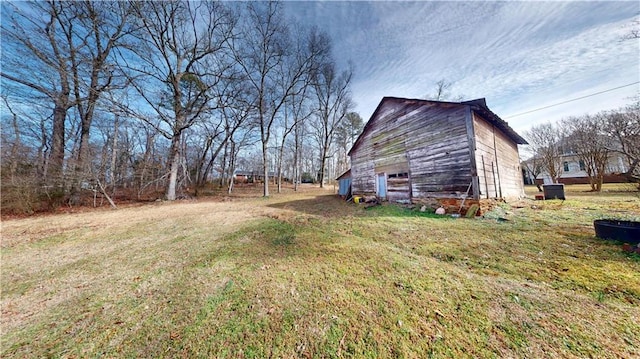 view of yard with a barn and an outdoor structure