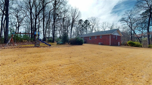 view of yard with a playground