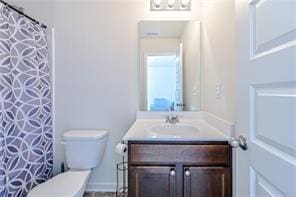 full bathroom with a shower with shower curtain, vanity, and toilet