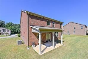 rear view of property with a patio area and a yard