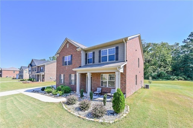 view of front facade featuring central air condition unit, a porch, a front lawn, and brick siding