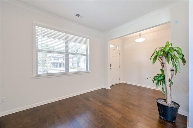 entrance foyer with dark wood-style floors, baseboards, visible vents, and ornamental molding