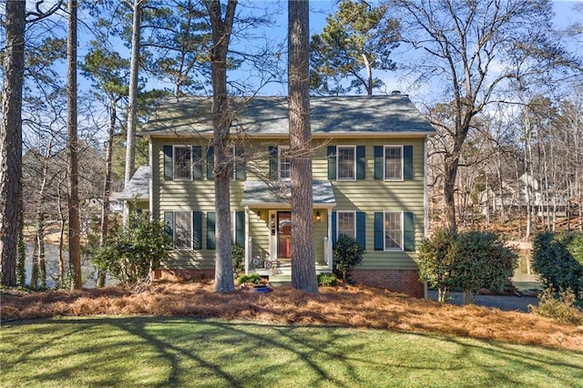 colonial home with a front yard