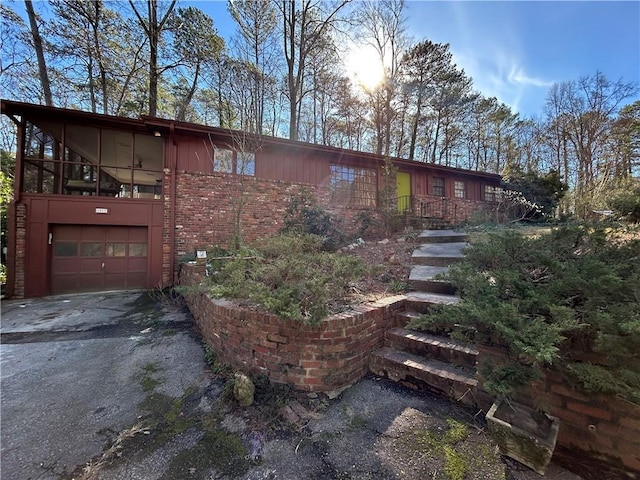 view of side of property with a garage