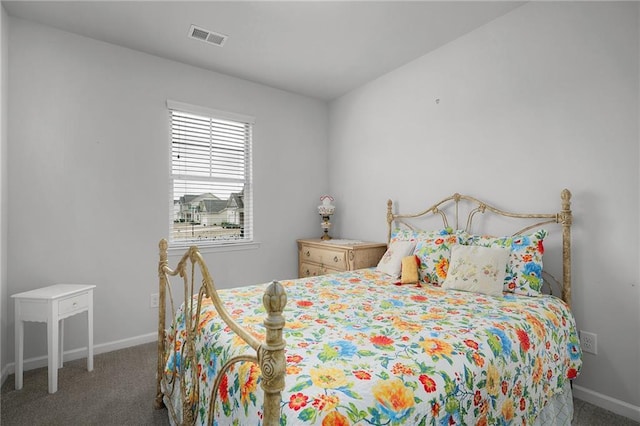 carpeted bedroom with baseboards and visible vents