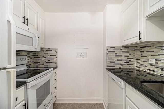 kitchen featuring light tile patterned floors, white appliances, backsplash, and white cabinetry